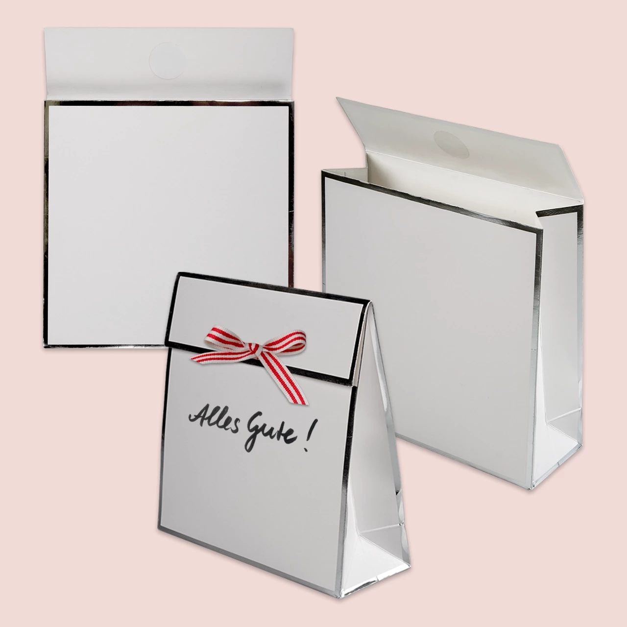Die weiße Geschenkbox sieht dank der silbernen Ränder besonders edel aus. Außerdem lässt sich die weiße Fläche individuell von euch beschriften und bemalen.